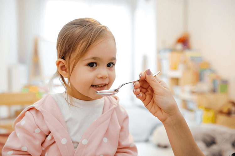 A person taking medication to treat pinworm infection